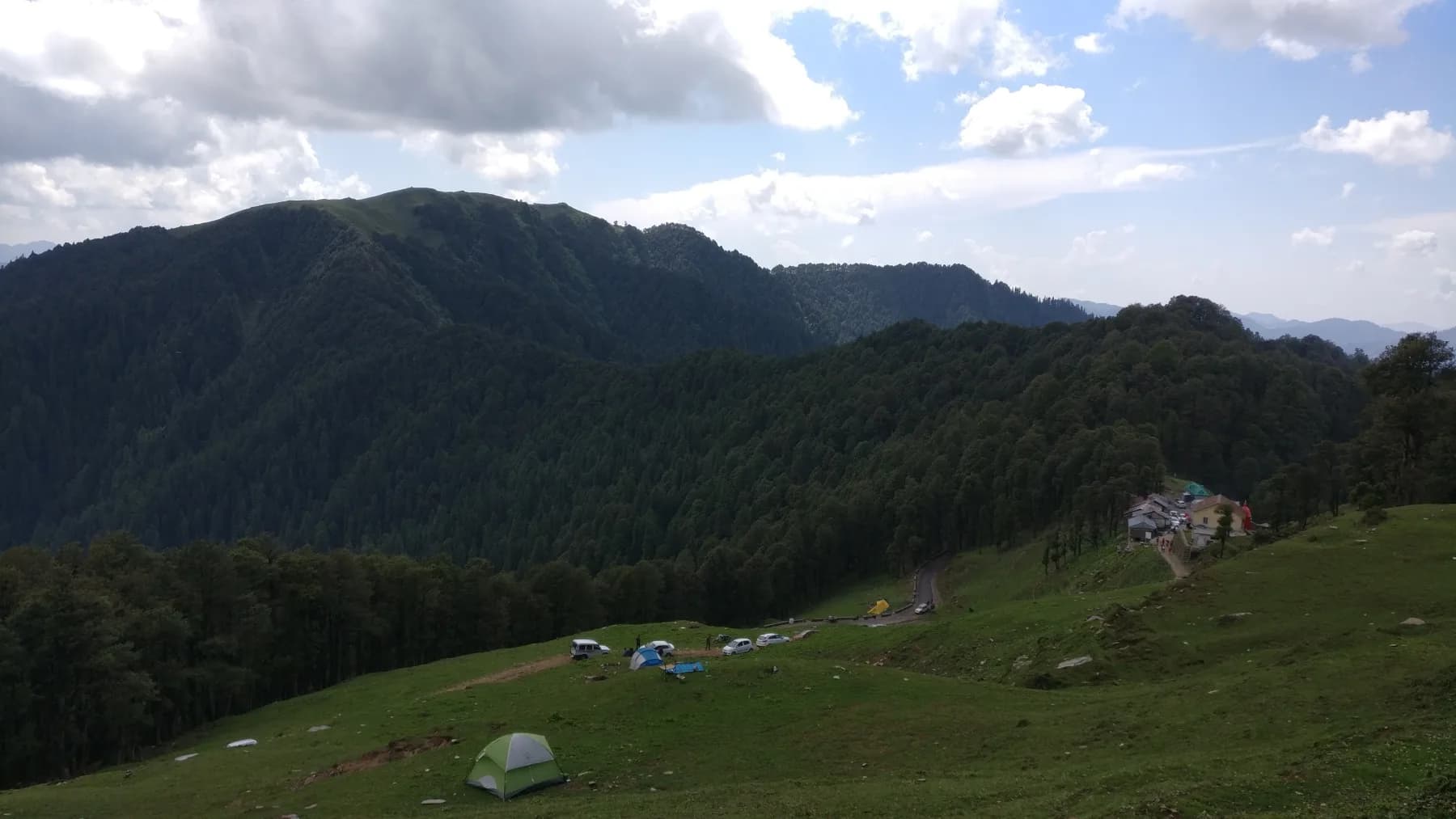 Forest-covered mountains and the roadside area at Jalori Pass