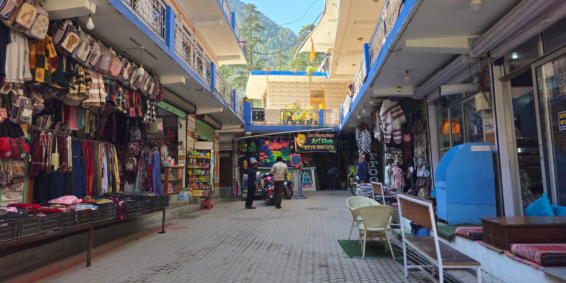 Shops along a narrow street in Kasol