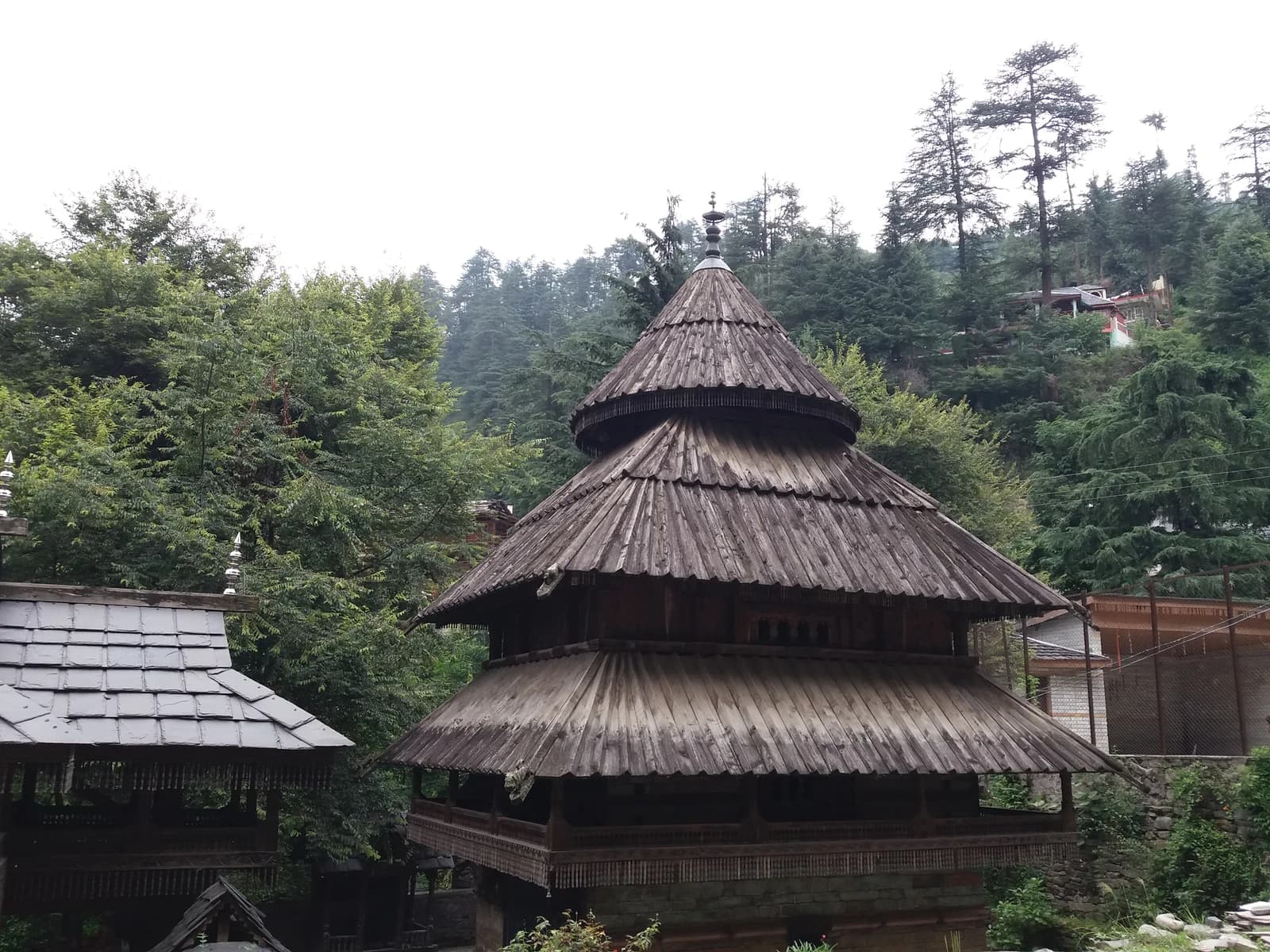 Tripura Sundari Temple's tiered wooden roofs above a stone base in Naggar