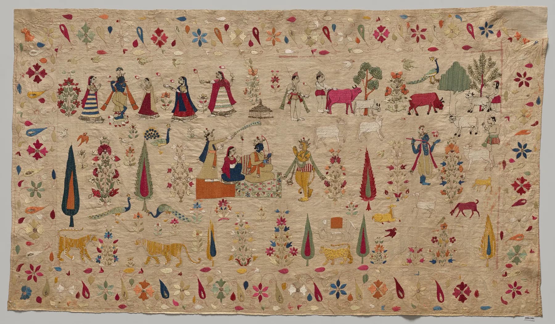 Colourful embroidered figures, animals and floral borders on a cream Chamba rumal